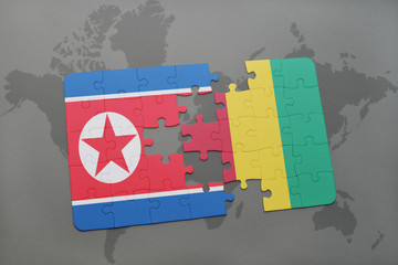 puzzle with the national flag of north korea and guinea on a world map