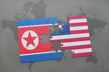 puzzle with the national flag of north korea and liberia on a world map
