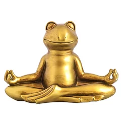 Muurstickers Glimlachende gouden yogakikker die in lotusbloemhouding mediteert. Evenwichtsconcept voor lichaam, geest en ziel. Geïsoleerd op wit © Iuliia