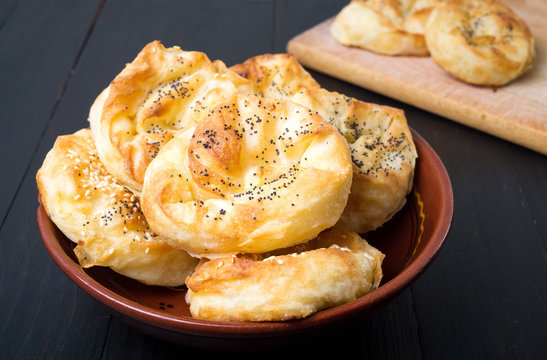 Homemade cheese pie rolls covered with sesame