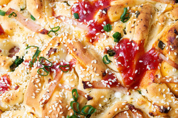 Pizza bread with sesame onions and ham