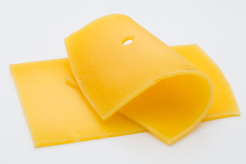 Cheese slices on white background cutout.