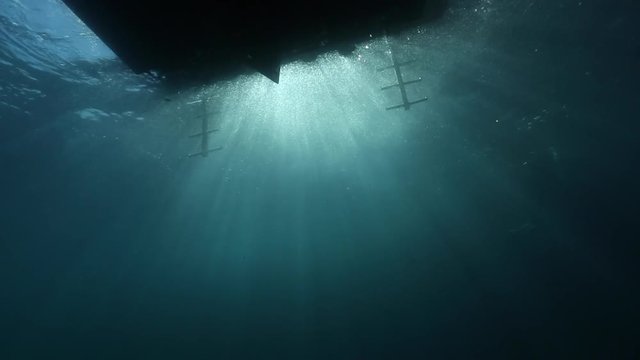 Scuba diving entry into ocean underwater view