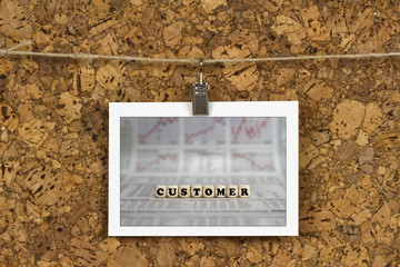 Fototapeta premium Customer word on business card pinned up on cork board