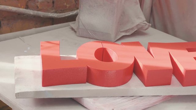 Decorative inscriptions Love. Decorative three-dimensional figures of expanded polystyrene for decorating the wedding ceremony. Volumetric inscriptions and decorations for ceremonies.