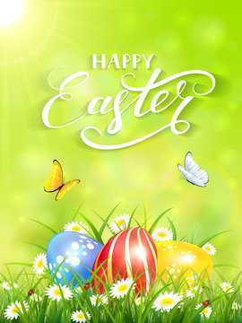Green background with butterflies and three Easter eggs in grass
