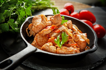 fish Chinook salmon sauteed with vegetables, tomatoes, onions and spices