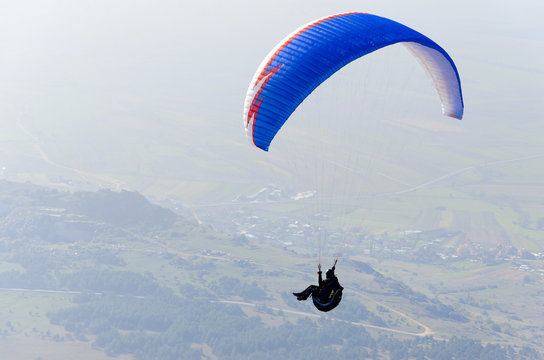 PRILEP, MACEDONIA - circa FEB, 2017: Paraglider flies paraglider in the sky. Paragliding