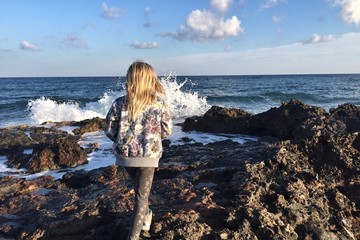 girl walking on rocks