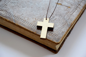 Cross over old book 
