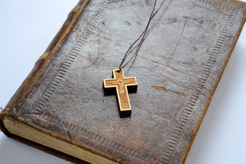 Cross over old book 