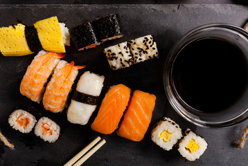 Slate tray of assorted sushi
