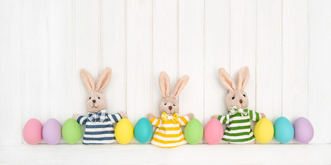 Easter decoration eggs funny bunny wooden background