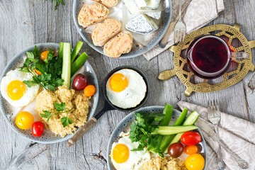 Food, healthy Breakfast, porridge, eggs, vegetables and sandwiches with caviar