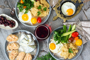 Food, healthy Breakfast, porridge, eggs, vegetables and sandwiches with caviar