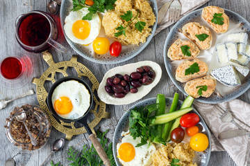 Fototapeta na wymiar Food, healthy Breakfast, porridge, eggs, vegetables and sandwiches with caviar