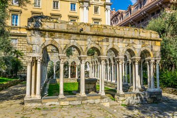 view of ruin of a 12th century cloister standing between Porta Soprana and Christopher Columbus'...