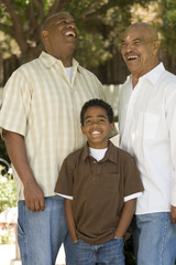 Grandfather with his adult son and grandchild.