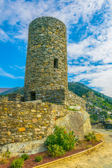view of a tower of the doria castle situated in vernazza village, cinque terre, italy.