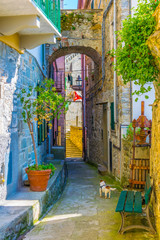 view of a narrow street waiting for tourists to come in corniglia, cinque terre, italy.