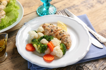 Tasty chicken breast with vegetables on plate