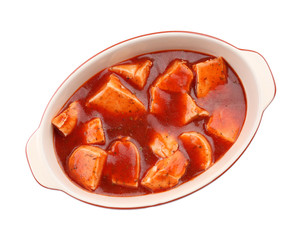 Chicken cacciatore in baking dish isolated on white