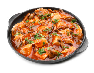 Chicken cacciatore in frying pan isolated on white