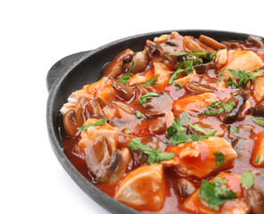 Chicken cacciatore in frying pan isolated on white