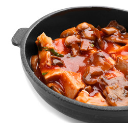 Chicken cacciatore in frying pan isolated on white