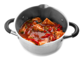 Chicken cacciatore in saucepan isolated on white