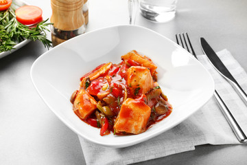 Plate with tasty chicken cacciatore on table