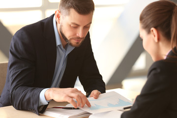 Young managers discussing issues in office © Africa Studio