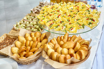 Snacks, canapes and patties on table