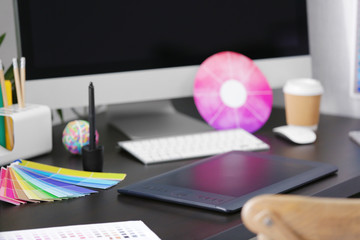 Modern workplace of designer with modern devices