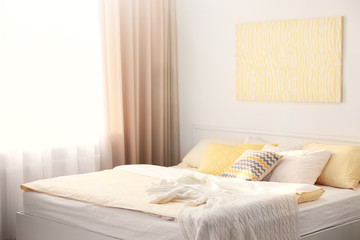 Fototapeta na wymiar Interior of modern bedroom with cozy bed