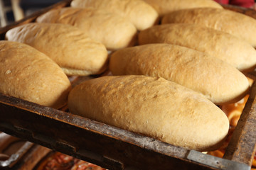Wooden pallet with bread, closeup
