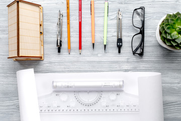 profession concept with architect desk and tools wooden background top view