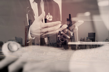 Medical co working concept,Doctor working with smart phone and digital tablet and laptop computer to meeting his team in modern office at hospital