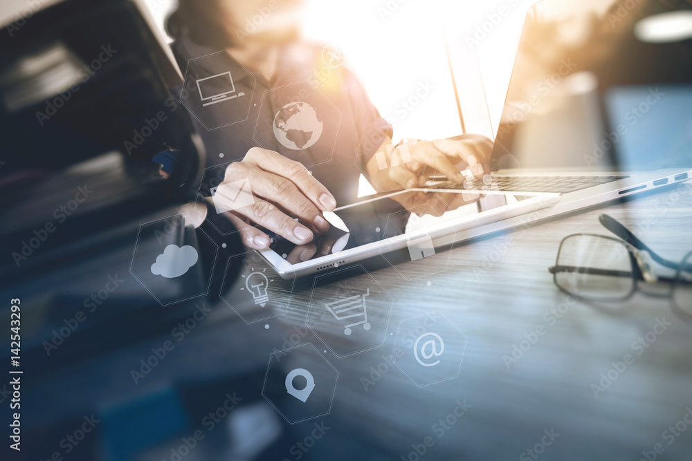 Poster businessman working with laptop computer and digital tablet and book and document on wooden desk in 