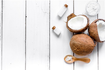 organic cosmetics concept with coconut on table background top view