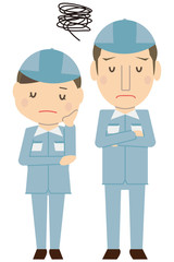 作業着を着たさわやかカップル　悩む