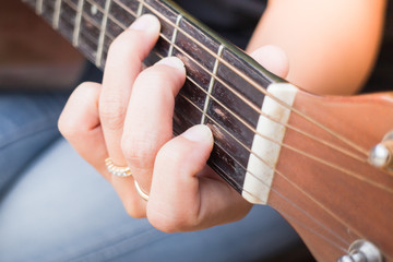 Fototapeta premium Guitarist Hand Playing Acoustic Guitar