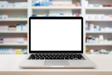 pharmacy store with laptop computer on medical counter