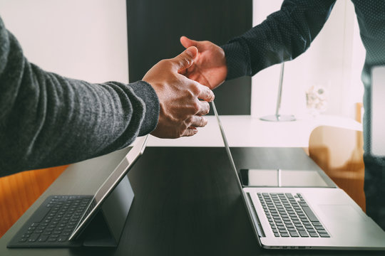 Business partnership meeting concept.photo businessmans handshake. Successful businessmen handshaking after perfect deal