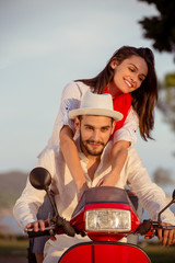 Fototapeta na wymiar Couple in love riding a motorbike , Handsome guy and young sexy woman travel .