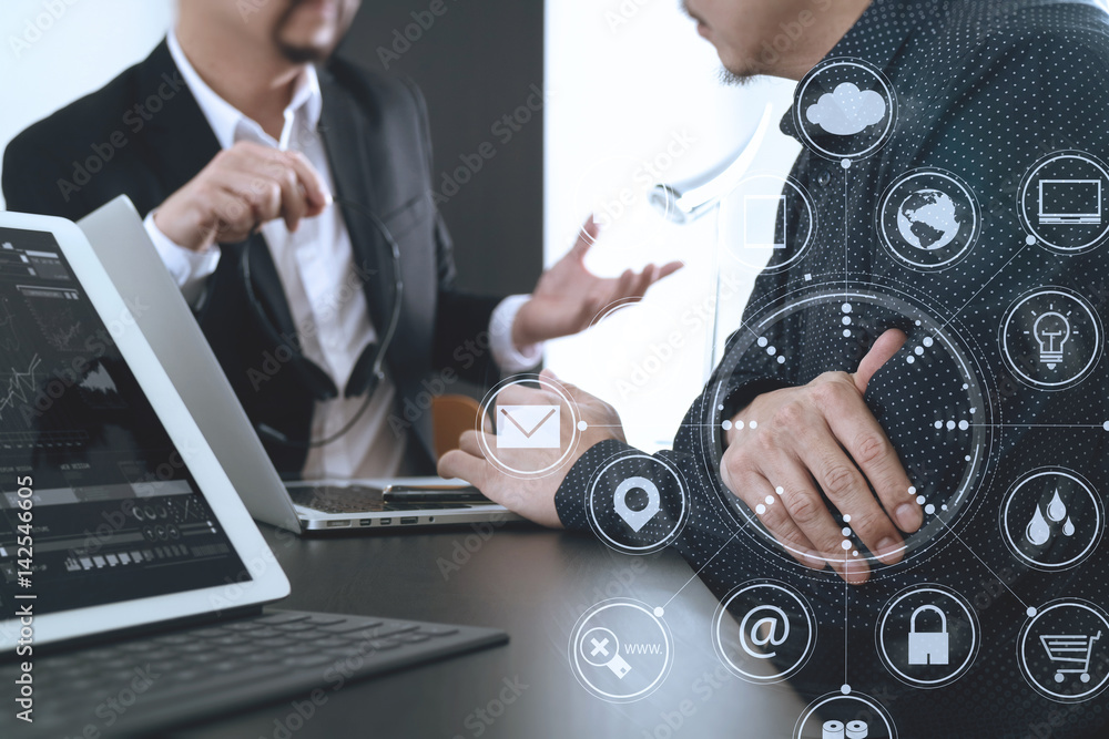 Aufkleber Co working team meeting concept,Man using VOIP headset with digital tablet and latop computer and smart phone in modern office