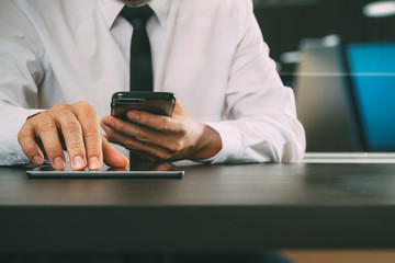 lawer working with smart phone and digital tablet computer in modern office