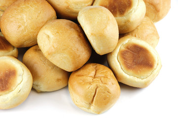 close up on fresh baked dinner roll isolated on white background