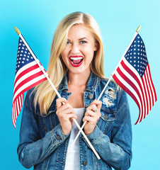 Young woman holding American flag