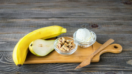 Set of products for making sandwiches from bread and ripe fruit pear banana